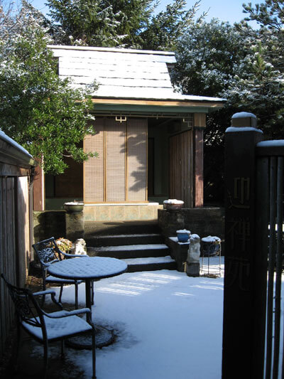 The outdoor Zen Bath house dusted with winter snow